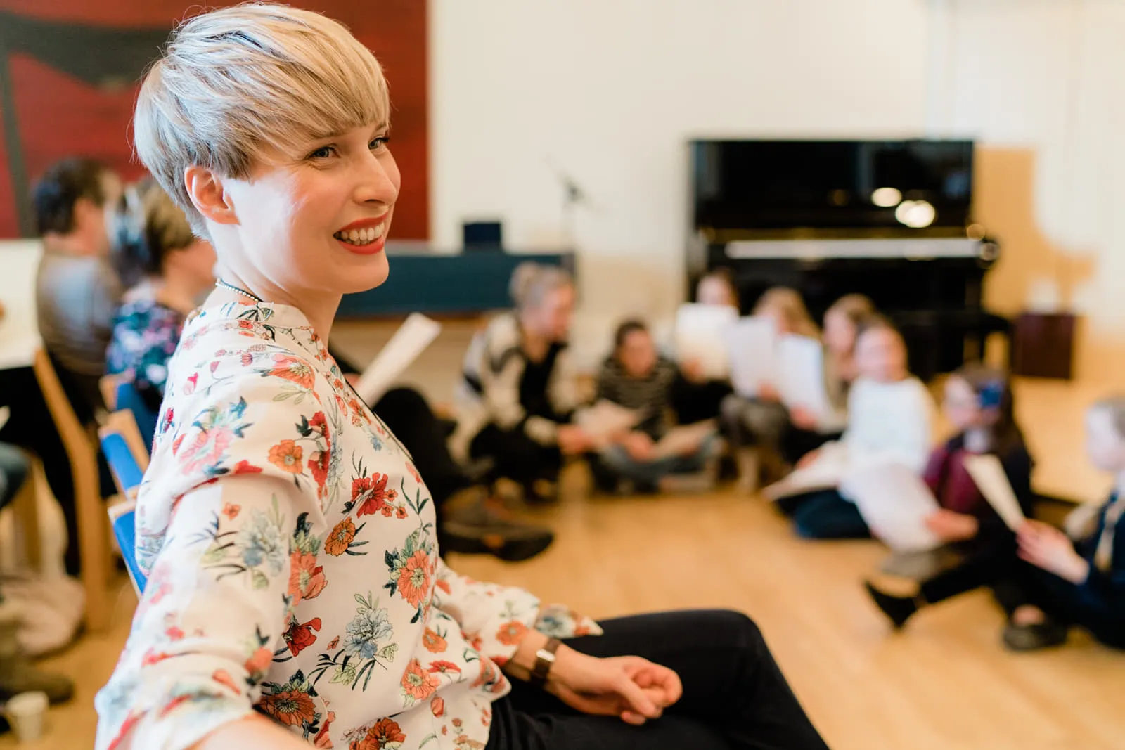 Maiju Roine at a piano class, surrounded by her students
